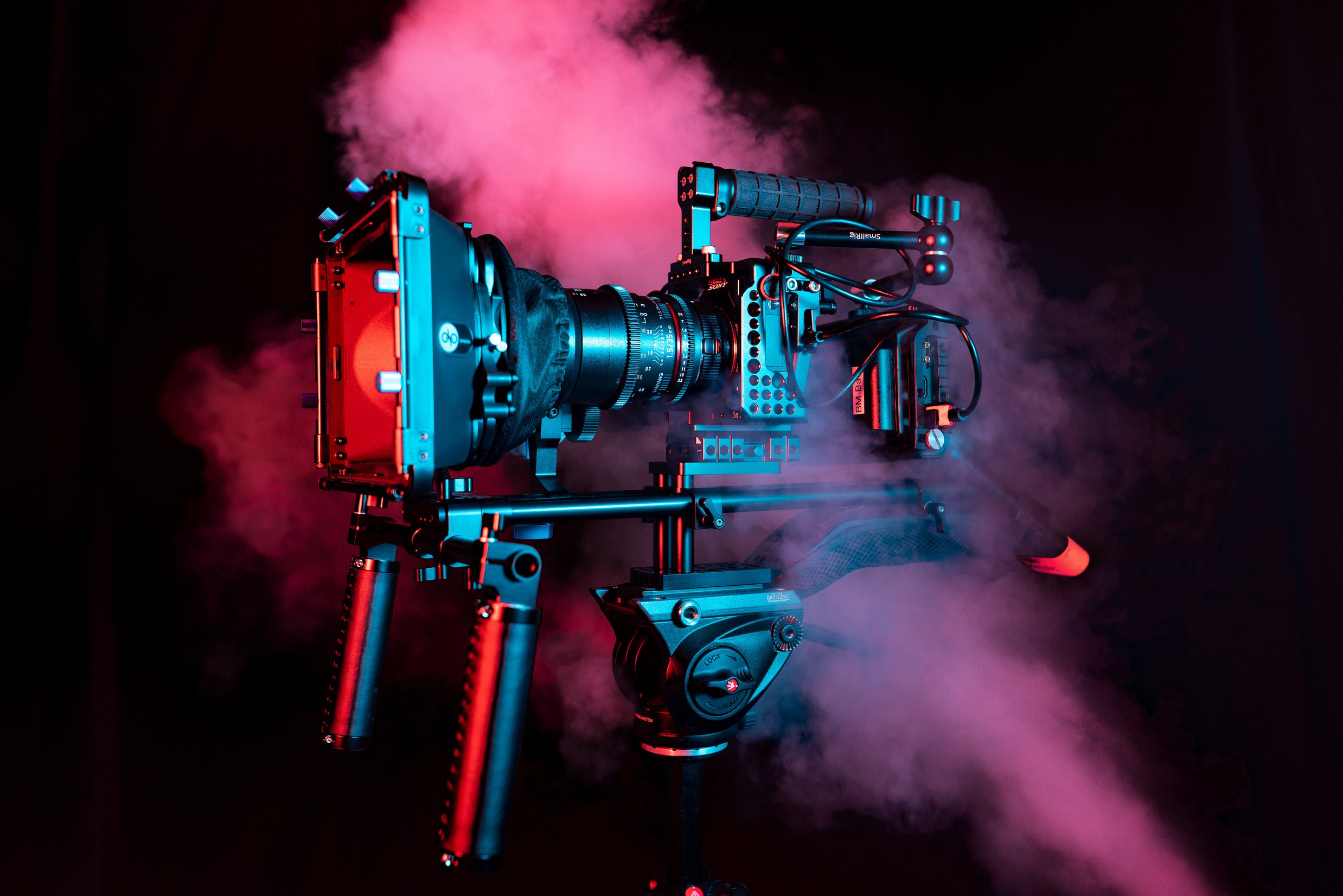 Camera in Dark Background with Smoke